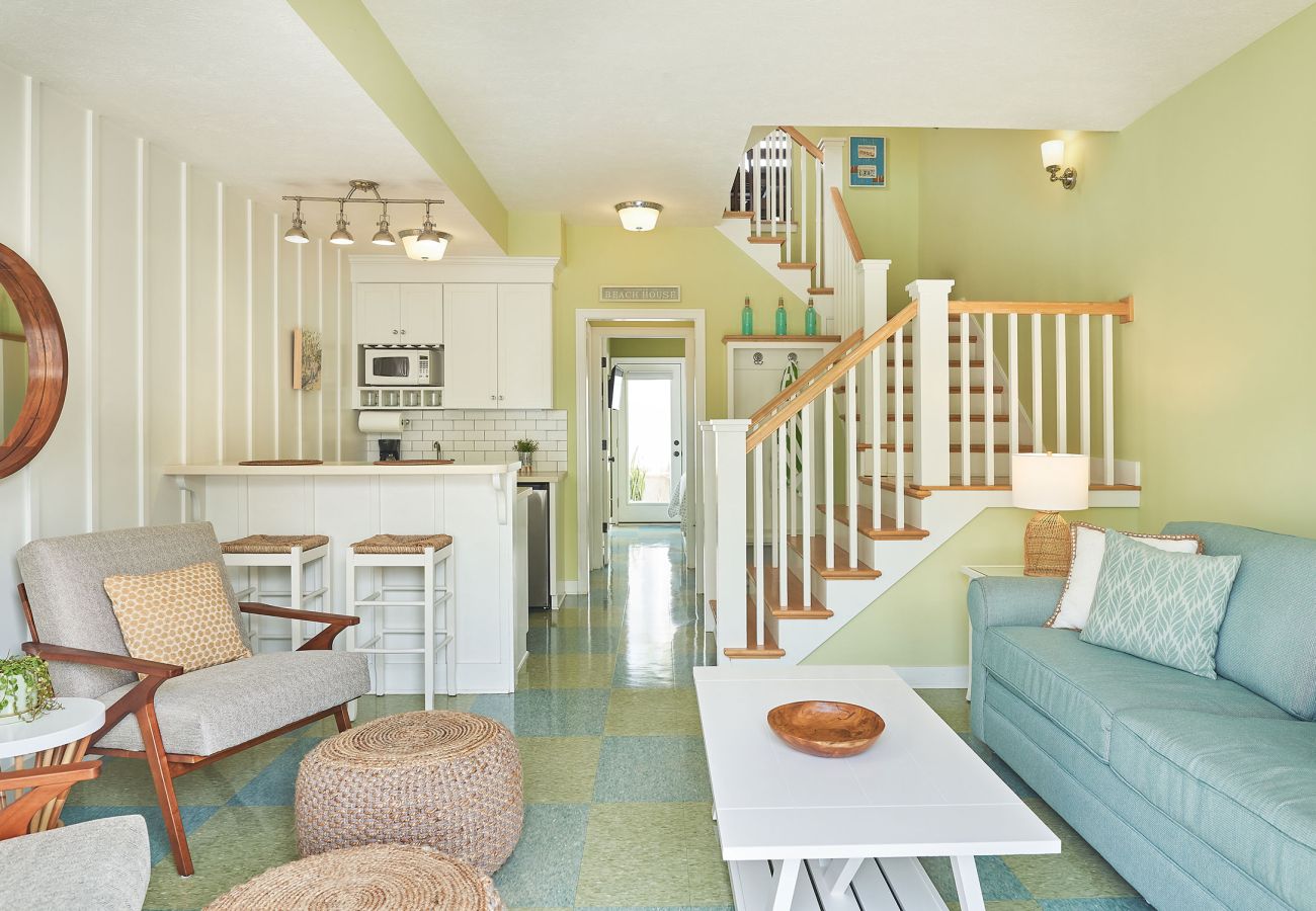 Living room with comfortable seating and mini kitchen 