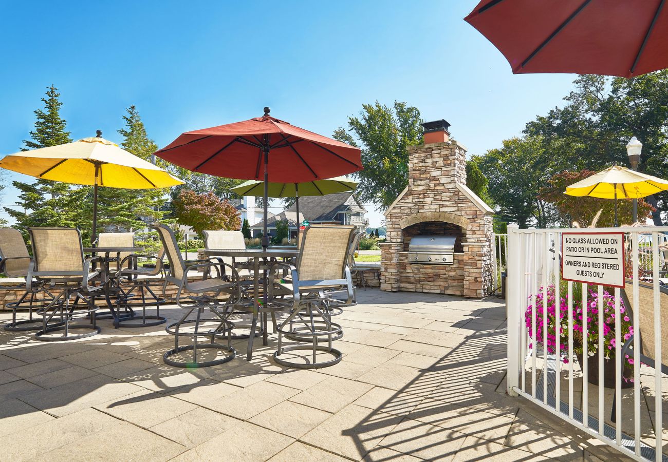 Grilling area with comfortable seating and umbrellas 