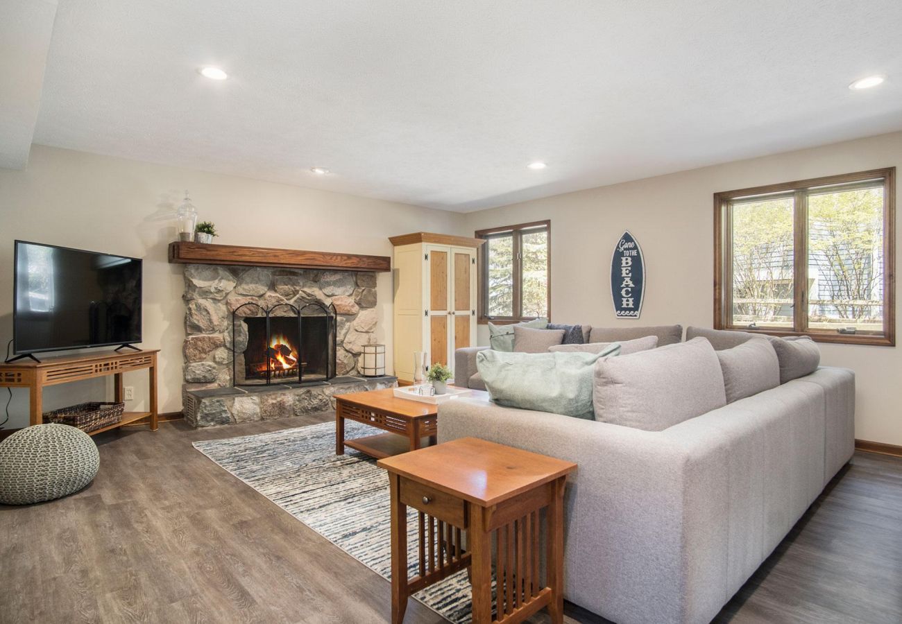 Second floor living area with fireplace, TV, and comfortable seating 