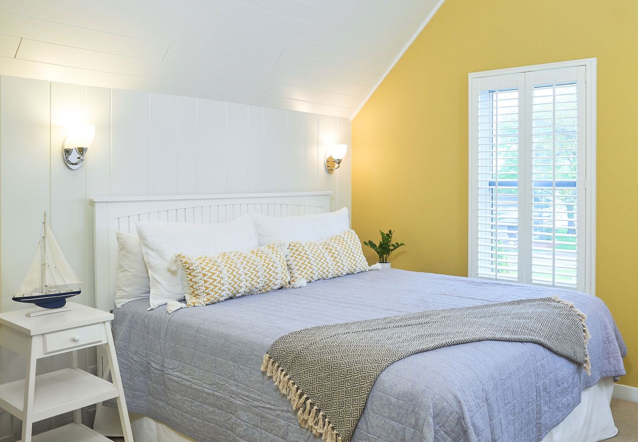 Primary bedroom with outdoor views 