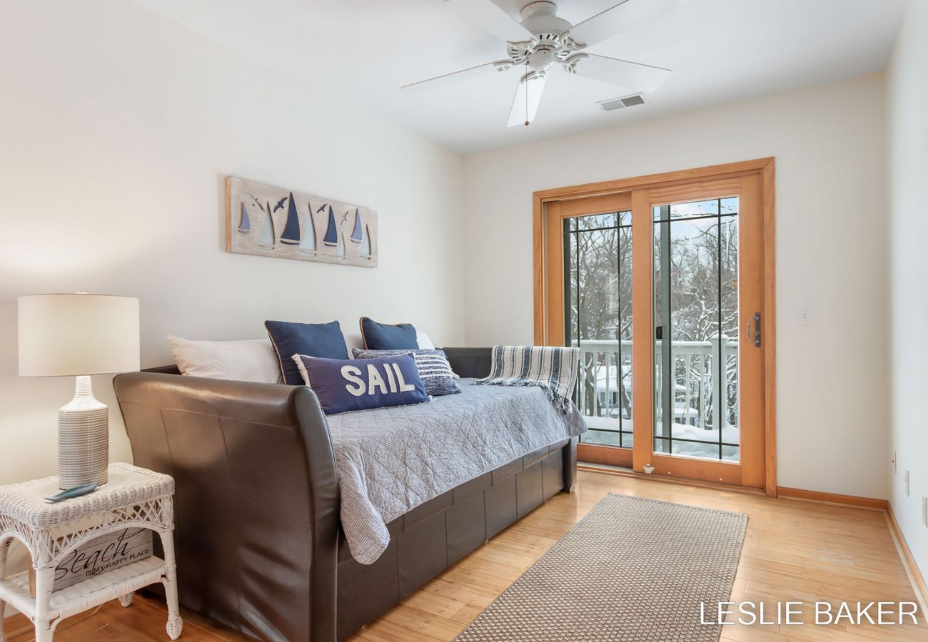 Day bed on second floor provides additional sleeping space. Bed pulls out from bottom. Slider door for balcony access.