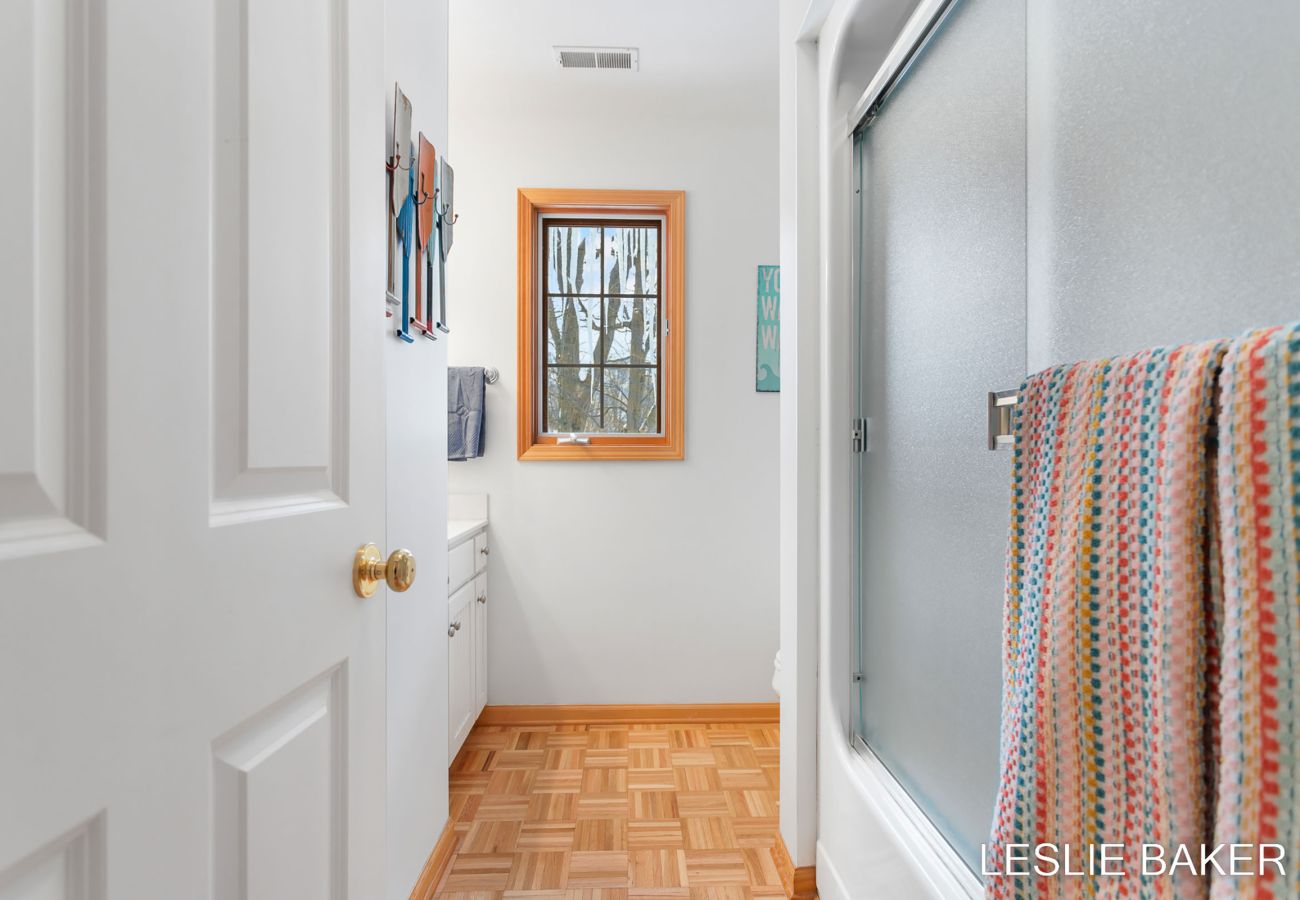 Second floor bathroom includes shower, toilet and sink