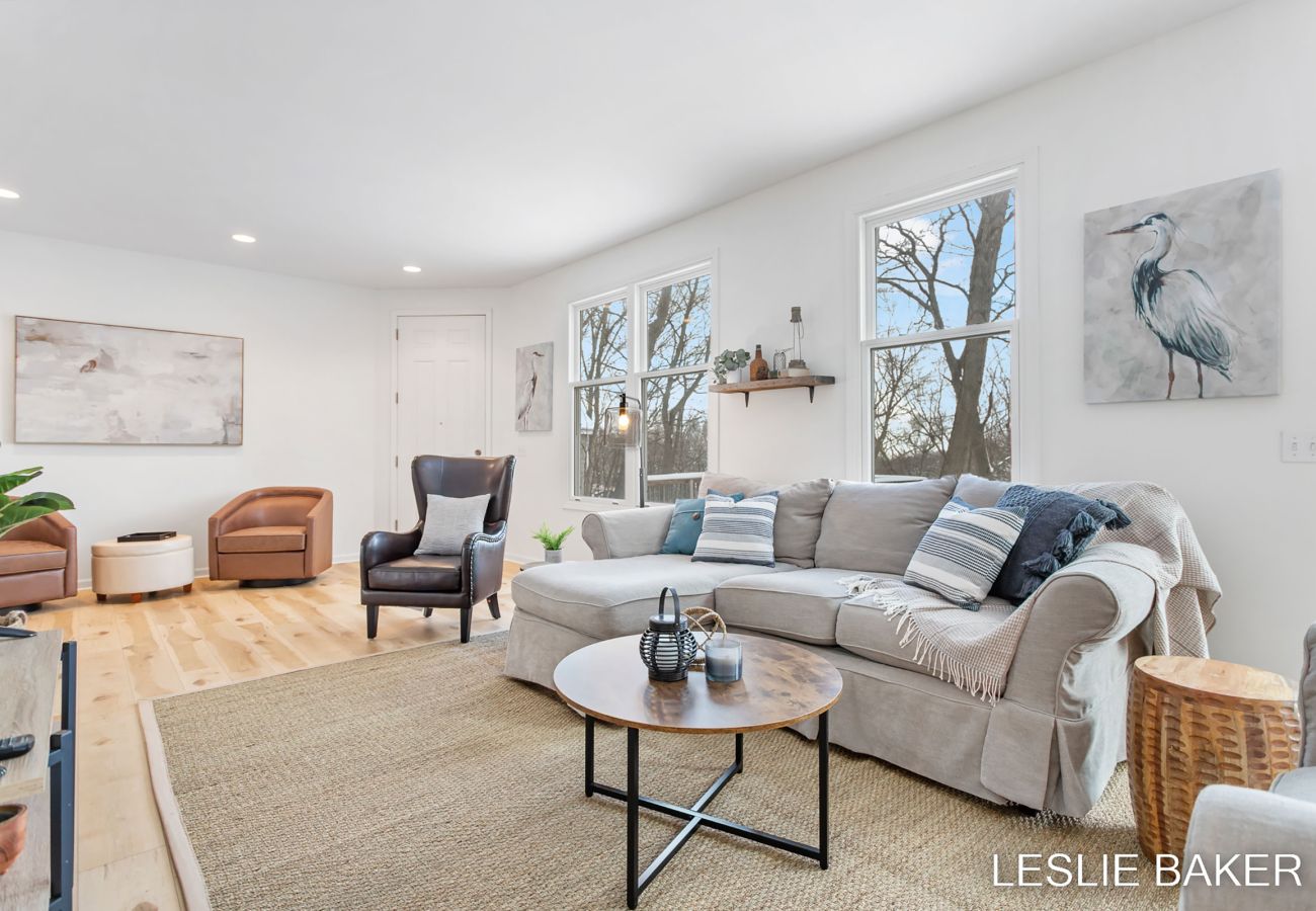 Front door access point, additional leather chairs for added seating in the living room