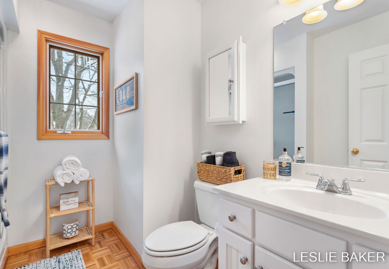 Second floor bathroom includes shower, toilet and sink