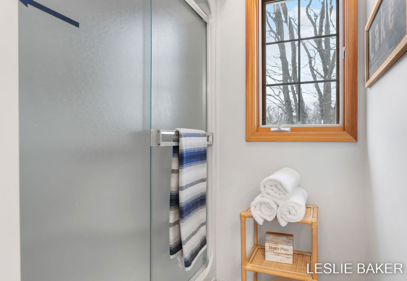 Second floor bathroom with shower, toilet and sink