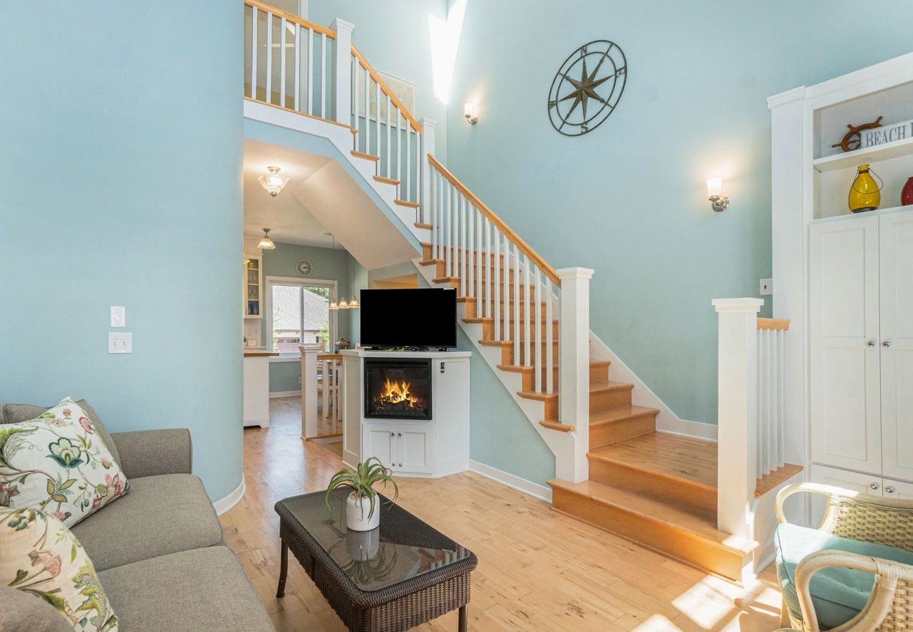 Living room on the second floor and staircase to the third floor